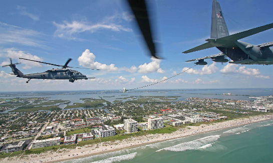 Two Pave Hawk crews and a Lockheed C-130 from the 920th conduct a refueling demonstration off Cocoa Beach.