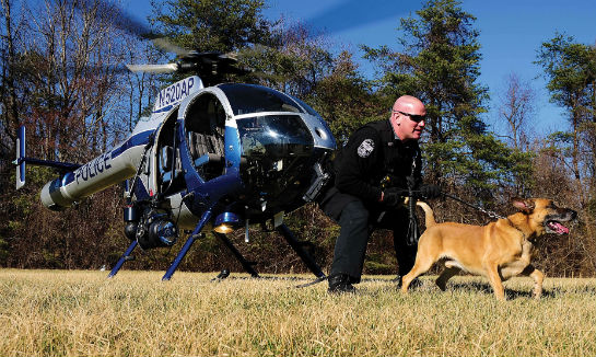 The ASU works with multiple units within the police department. Here, the aircraft deploys a K-9 team during an insertion training event.