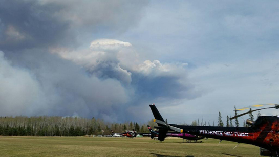 Phoenix relocated to a work camp 100 kilometers south of Fort McMurray, but even from that distance, the enormous smoke plume -- about 50,000 feet high -- was clearly visable. Paul Spring Photo