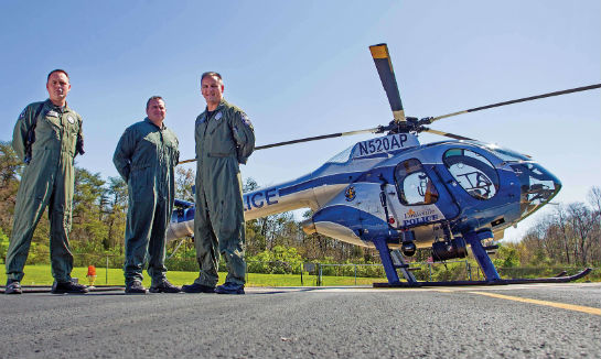 From left, the ASU’s Pilot/Officer Chris Colburn, Lt. Brent Routzahn, and Pilot/Officer Bryan Arnold pose with the unit’s MD 520N. Wales Hunter Photo