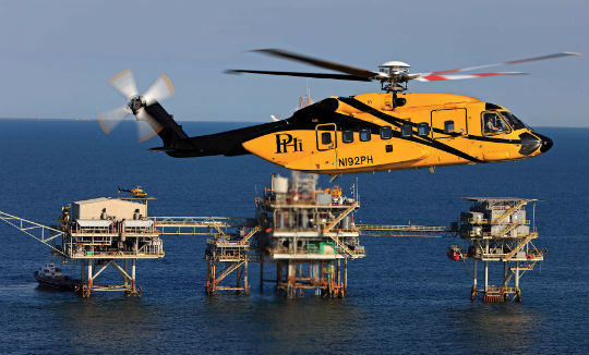 A PHI Sikorsky S-92 flies offshore in the Gulf of Mexico. About two-thirds of the company’s revenue derives from offshore transport to rigs in the Gulf; most of the rest comes from its EMS operations. Ted Carlson Photo