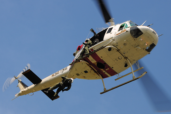 During a hoisting operation, SBSDs Bell 212, Air Rescue 7, carries a three-person flight crew. In this particular evolution, airmedic Dr. Steve Patterson is on the hook.