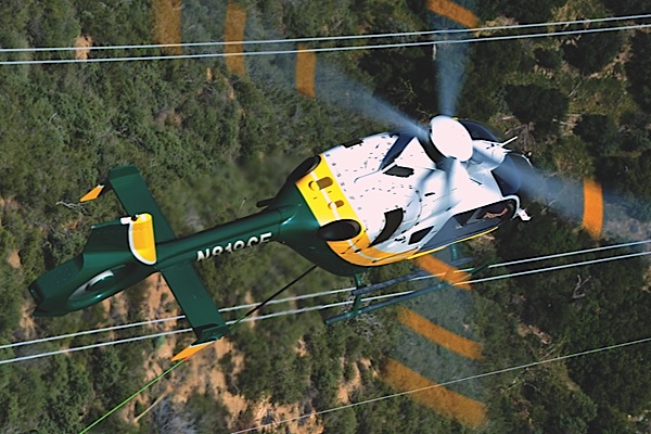 In SCEs human external cargo program, a Eurocopter EC135 P2+ is used to transport up to two line workers from ground level to the top of transmission towers using a type of long-line system.