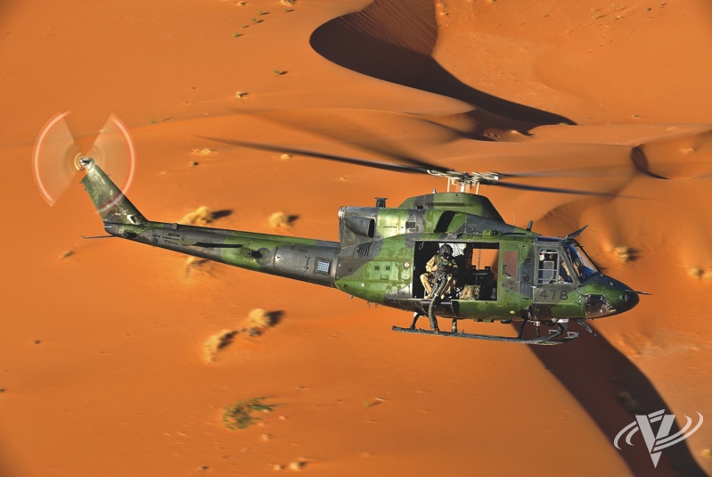 A Canadian CH-146 Griffon flies over the Red Desert near Kandahar on a training mission. Graham Lavery Photo.