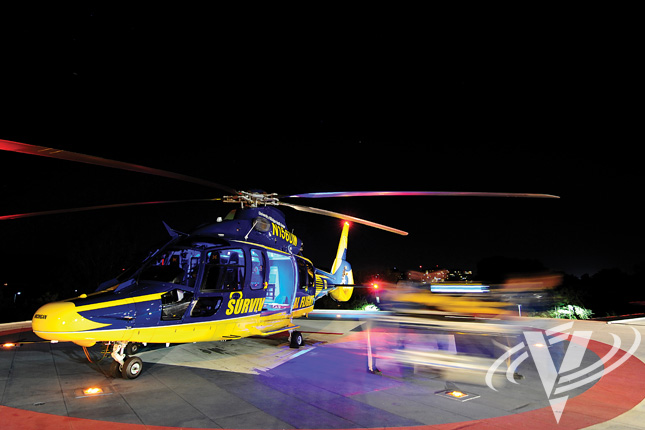 Flight nurses transport a patient from one of Survival Flight's new EC155s into University Hospital in Ann Arbor, Mich.