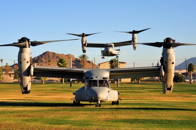 Two MV-22Bs insert themsleves into a parade area of 29 Palms, during initial insertion of U.S. Marine security forces.