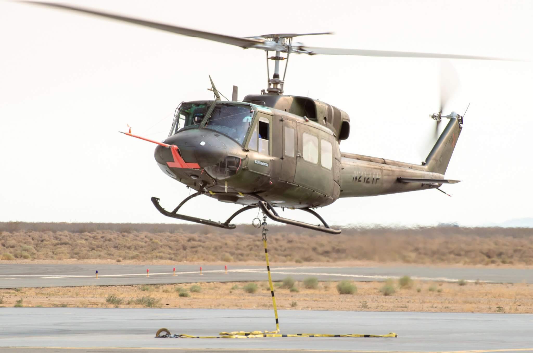 Pilots training in a helicopter at the at National Test Pilot School
