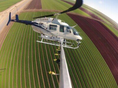Farm Aviation's Bell 206L-1 LongRanger spraying the lettuce in the Imperial Valley.