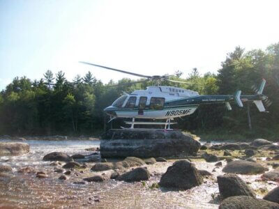 A Maine Forest Rangers Bell 407 takes advantage of a natural helipad.
