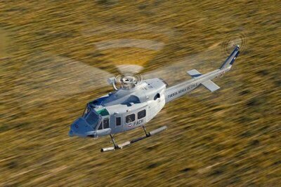 A FACh Bell 412 shot from a DHC-6 Twin Otter over the very south of Chile.