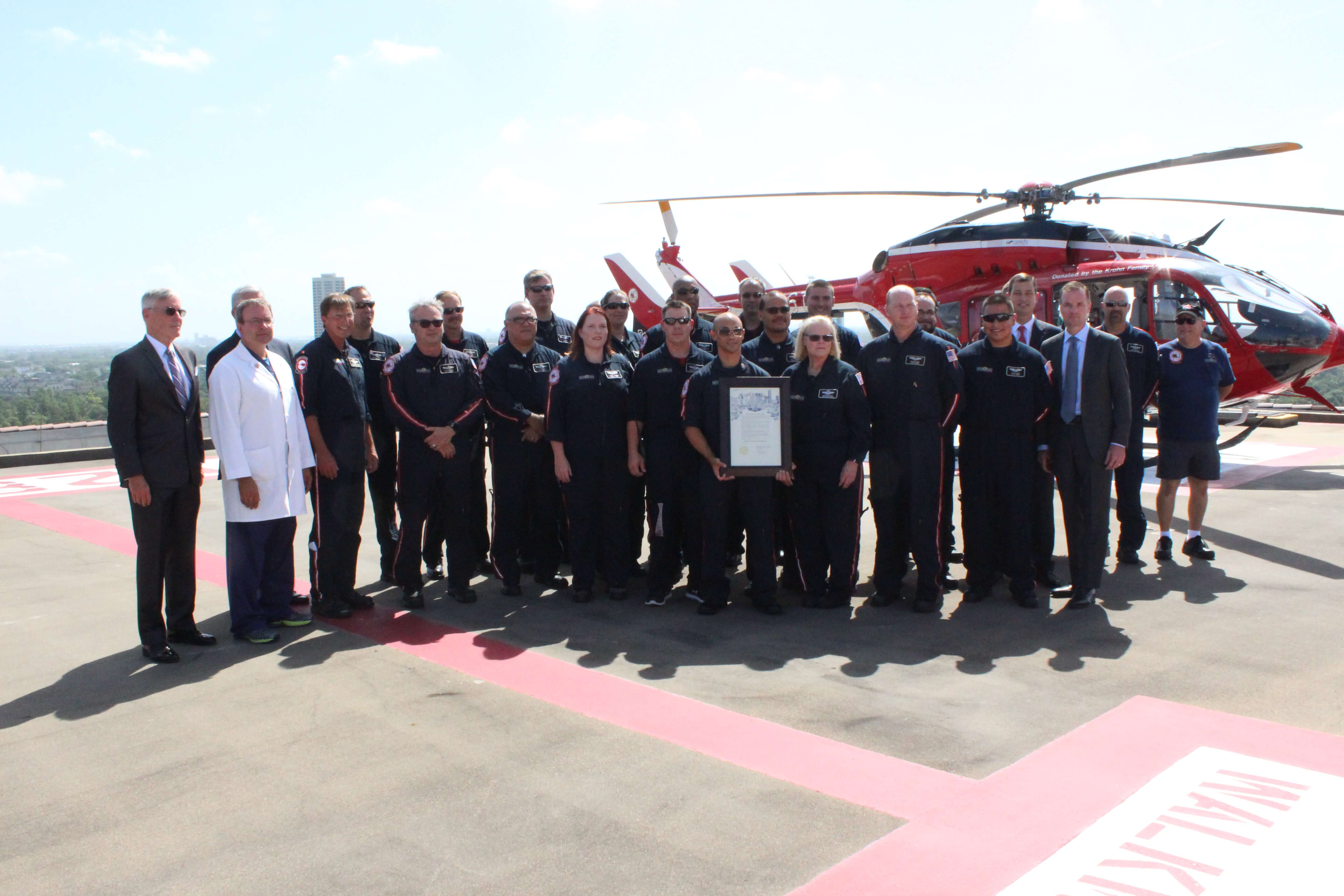 Memorial Hermann Life Flight team poses infront of one of their helicopters