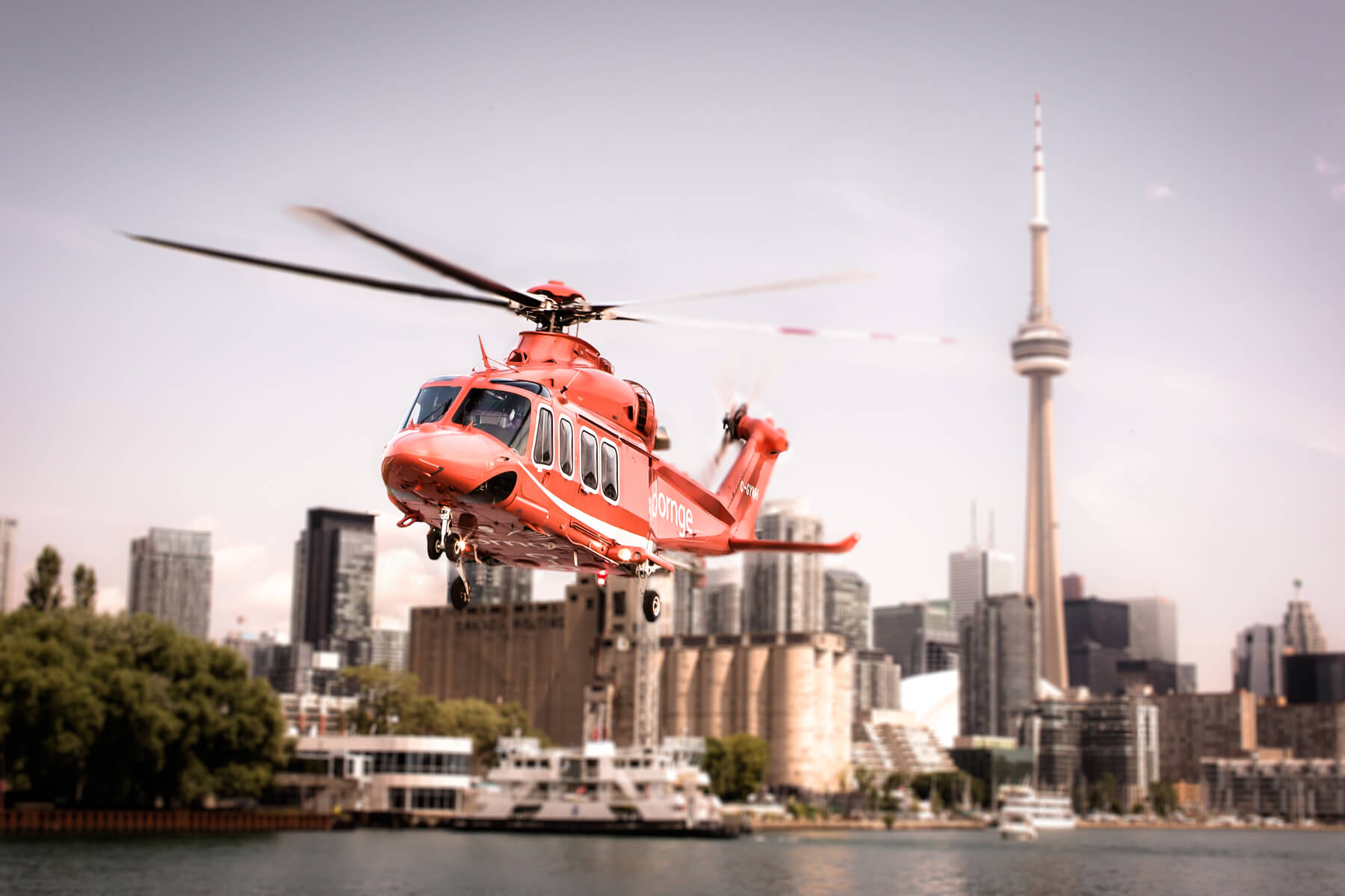 An AW139 flies above the city of Toronto.