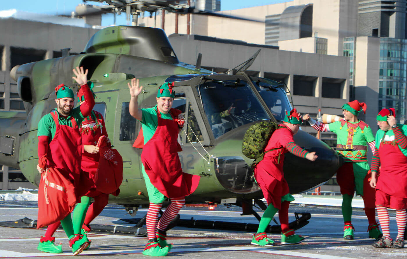 It's go time! The elves arrive on the rooftop helipad at SickKids hospital. Steve Bigg Photo