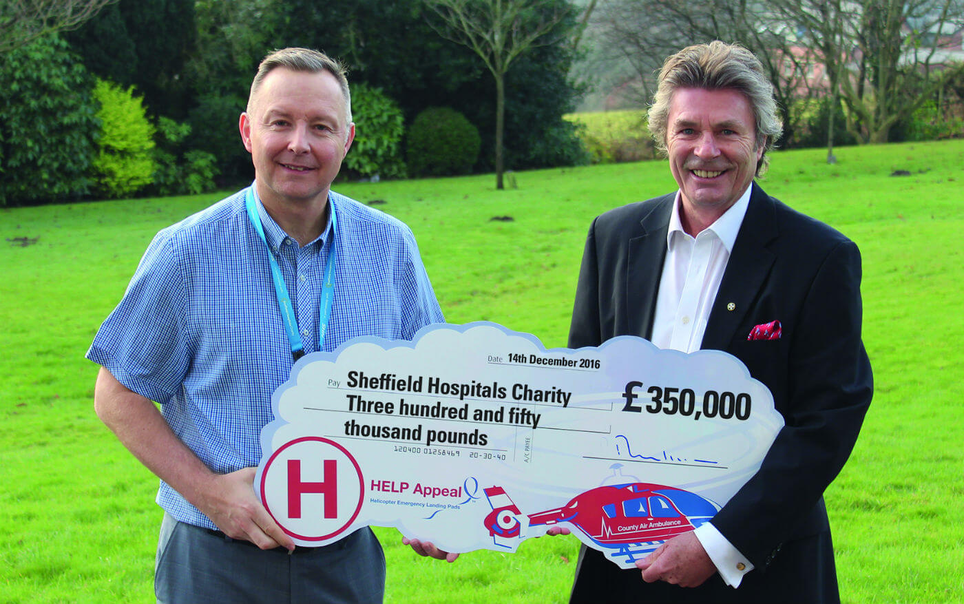 David Reynolds, director of Sheffield Hospitals Charity, receives the cheque from Robert Bertram, CEO, HELP Appeal. HELP Appeal Photo