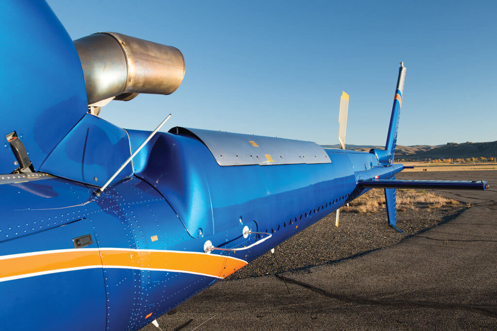 In addition to a tailboom strake and vortex generators, the FastFin kit for the H125 includes an aerodynamic tailboom cowling with improved heat shield. Although stainless steel on the test bed aircraft, the production heat shield will be made of aluminum to save weight. Photos by Dan Megna