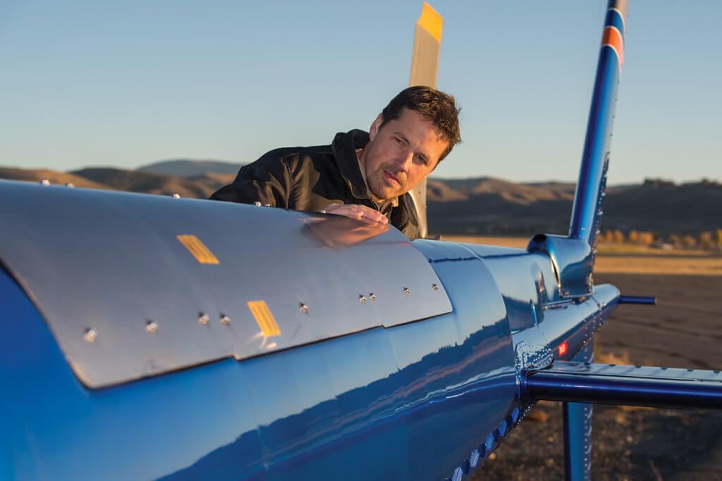 BLR director of helicopter programs and experimental test pilot Dan Smith examines the tailboom prior to flight.