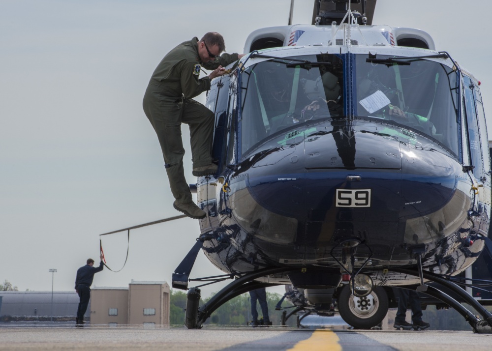 An UH-1N Iroquois pilot climbs off a helicopter after a flight at Joint Base Andrews, Maryland, April 13, 2017. The aircraft belongs to the 1st Helicopter Squadron, which conducts high-priority airlift missions and provides contingency response in the National Capitol Region. The squadron performed a medical evacuation of a downed pilot during the F-16 Fighting Falcon crash incident April 5. U.S. Air Force Photo