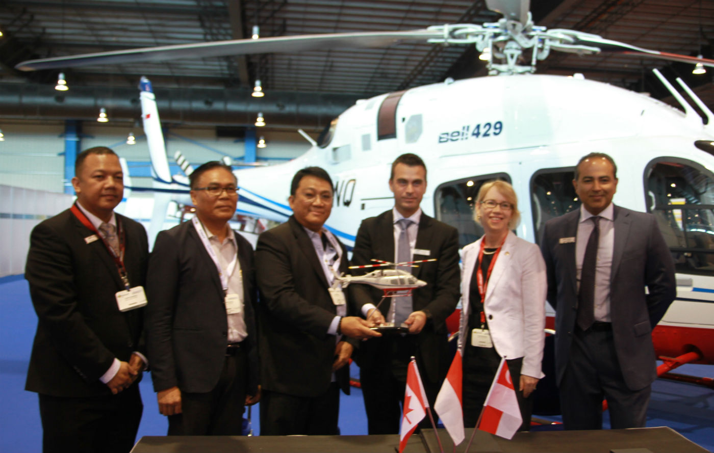 Bell Helicopter and PT Carpediem Mandiri celebrate the delivery with Nancy Lynn McDonald, High Commissioner of Canada to Singapore at Rotorcraft Asia. Bell Photo