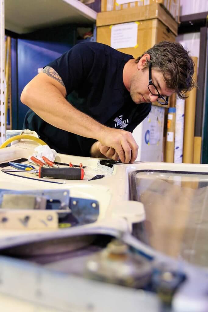 Structures technician Dean Sept repairs an Airbus cowling.