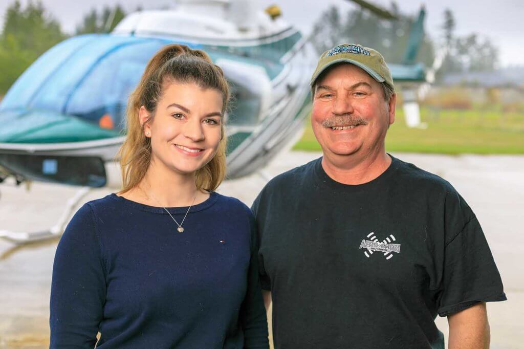 Holly Andrews stands with her father.