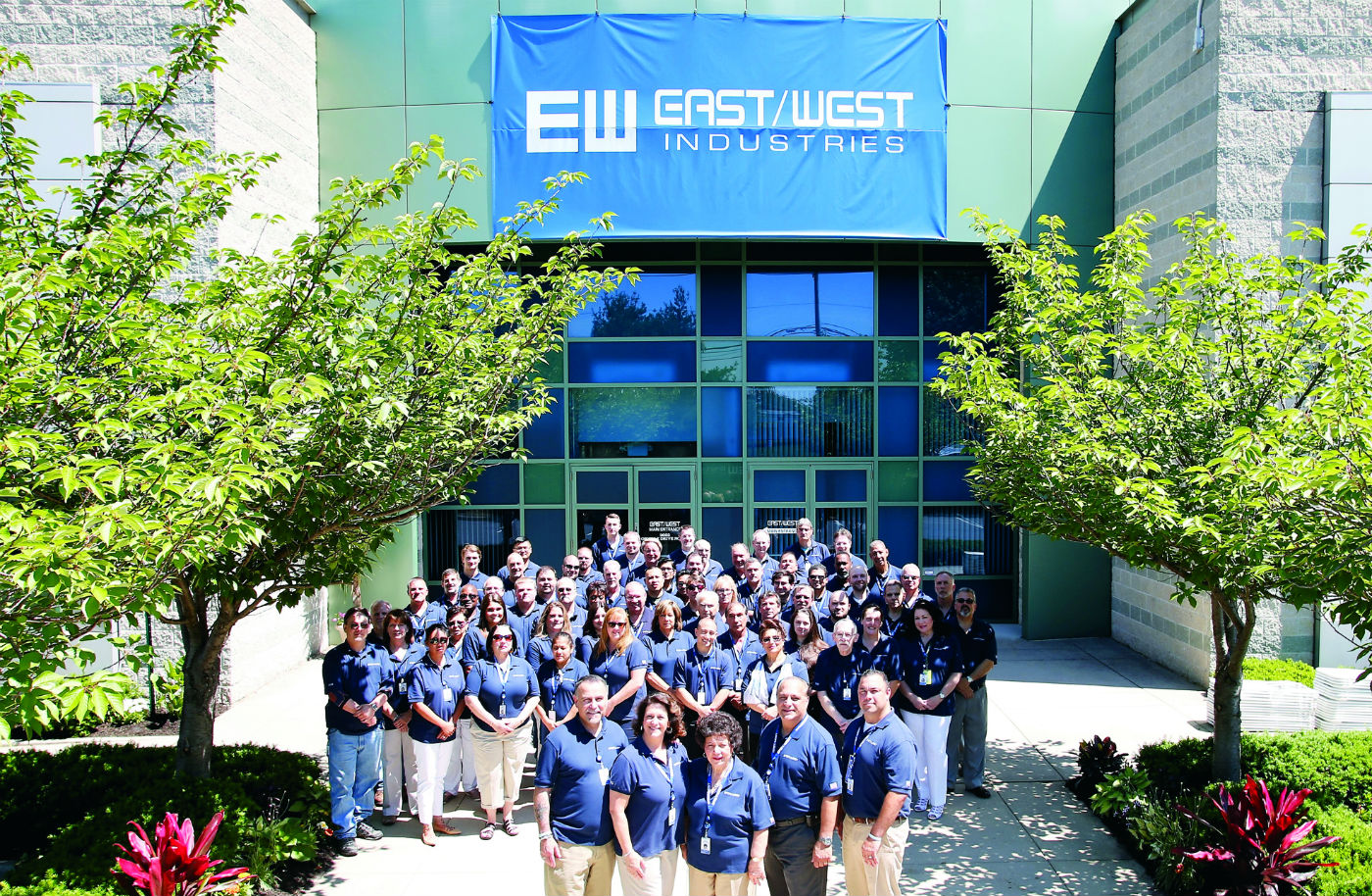 East/West company employees pose for a photo in front of the new facility. East/West Photo