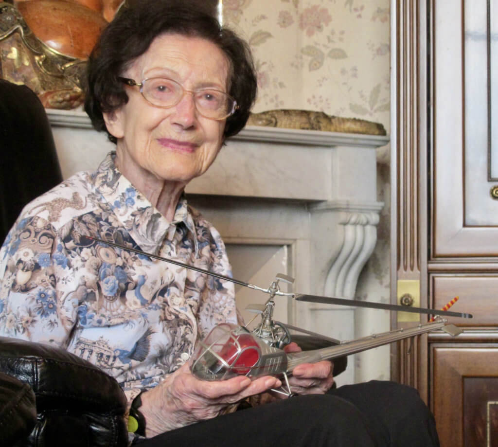 Valérie André in May 2017, at home near Paris, holding a model of the Hiller 360 helicopter. Thierry Dubois Photo