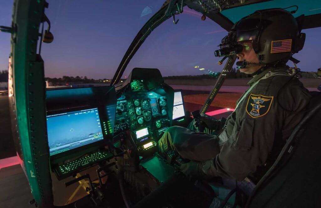 Deputy Sheriff Sean Marston preparing for an evening NVG patrol flight.