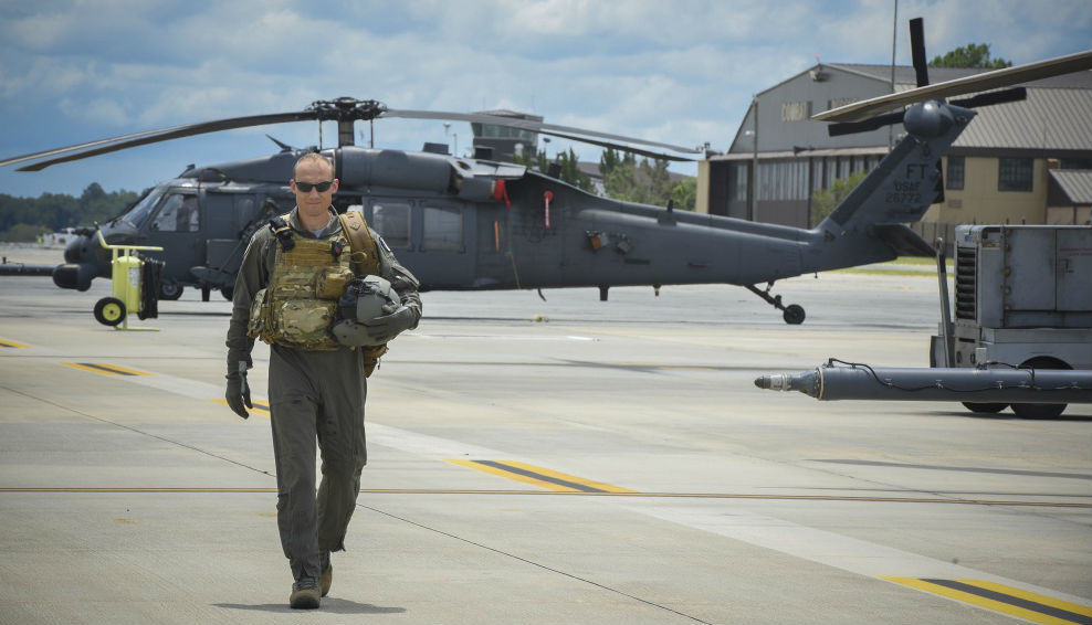 Commandant Micka, a French exchange pilot and assistant director of operations for Moody’s 41st Rescue Squadron, walks on the flightline past an HH-60G Pavehawk on Aug. 2, 2017, at Moody Air Force Base, Georgia. Prior to his arrival at the 41st RQS, Micka transitioned from flying the French Air Force’s EC725 Caracal helicopter to learn the HH-60. Since his childhood, Micka aspired to serve and fly for the French and U.S. military as a rescue pilot. U.S. Air Force Photo