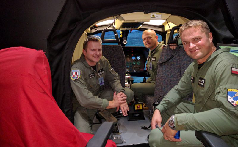 Polish Air Force helicopter pilots in the cockpit of the CAE-built SW-4 helicopter simulator now in-service for the Polish Air Force. CAE Photo