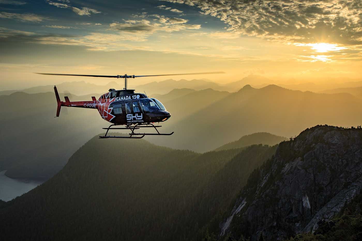 Sky Helicopters' Bell 206L LongRanger holds a hover as the sun sets over some beautiful backcountry near Vancouver, British Columbia. Heath Moffatt Photo