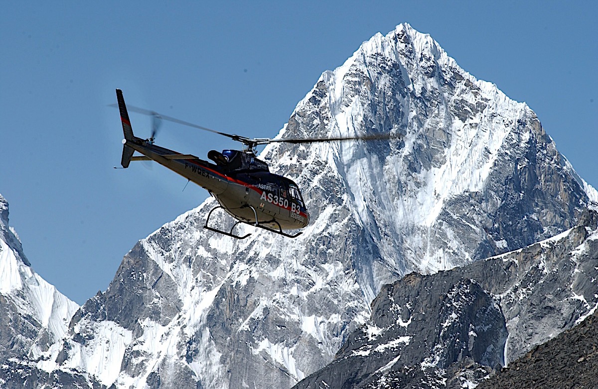 Airbus helicopter in flight near Mount Everest