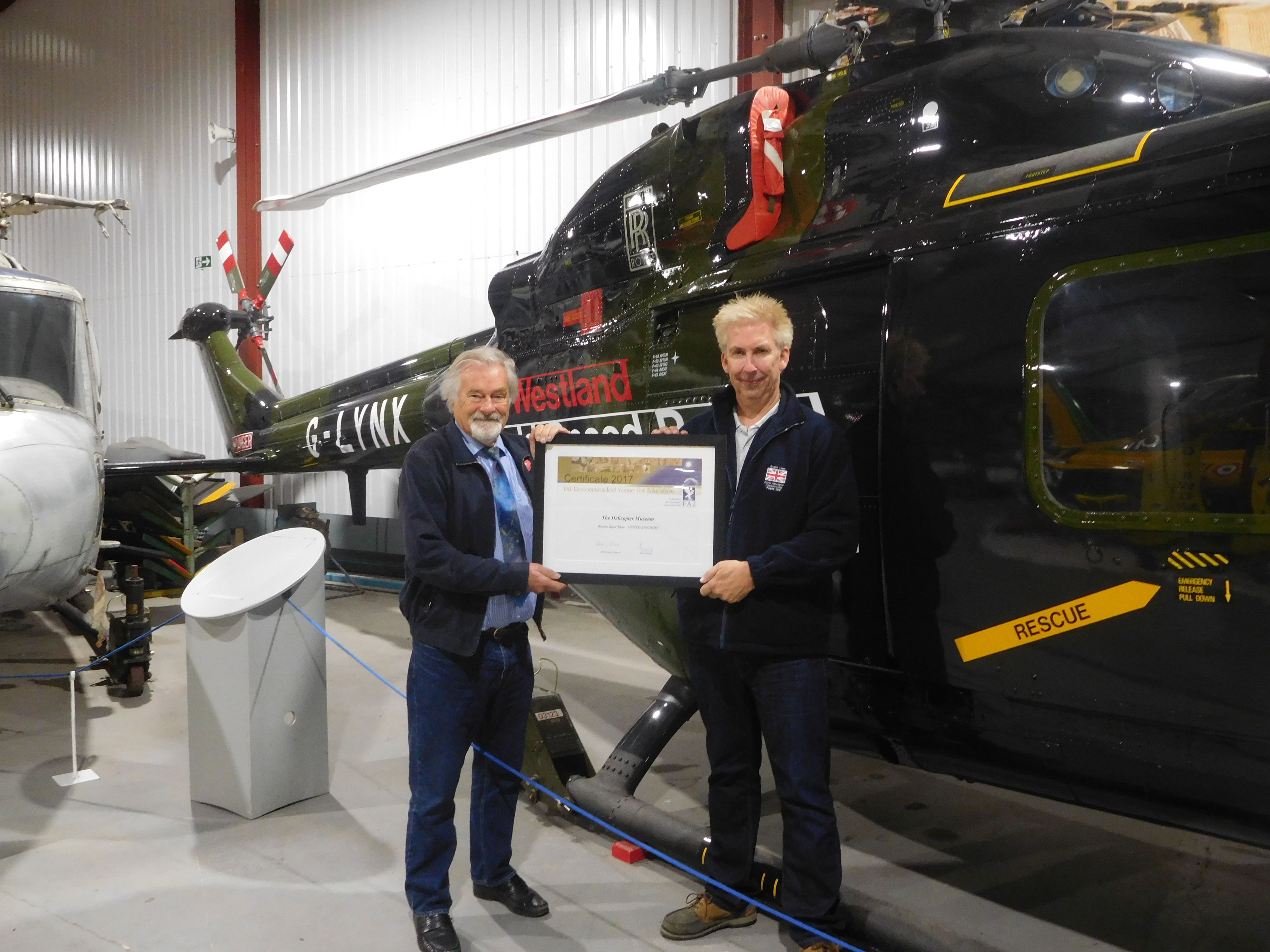 The award was presented to the museum's founder, Elfan Ap Rees, in front of the world speed record holder G-LYNX by U.K. representative of the FAI, David Monks. The Helicopter Museum Photo