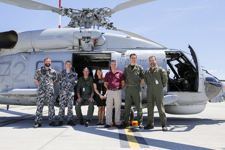 Leading Seaman Daniel Crowe ; Chief Petty Officer Michael Bryan; WO Brian Pashley ; Stephanie Boyle; Ian Parrott ; Lt Caleb Muggeridge; and LCdr Damien Liberale with the Australian Navy's S-70B-2 Seahawk helicopter fondly known as 'Christine.' Dallas McMaugh Photo