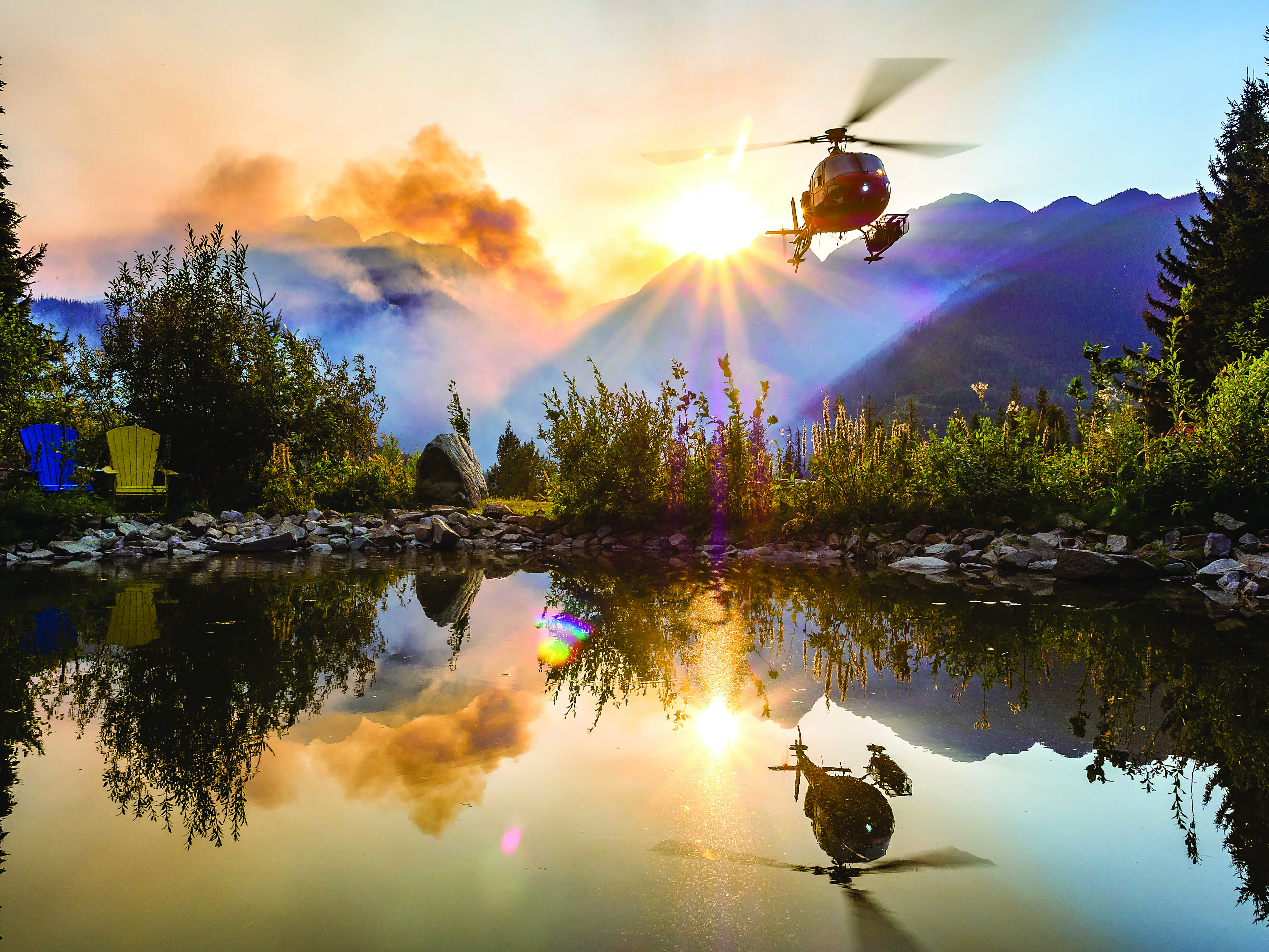 Maur Mere’s grand-prize-winning photo of an Airbus AS350 AStar perfectly reflected in a still mountain pond as it takes off to begin firefighting operations in British Columbia. Maur Mere Photo