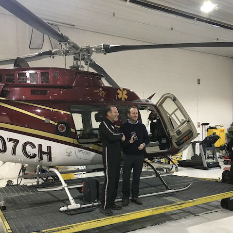 Matt Stein and Tony Henderson celebrate the milestone in front of a Bell 407. Classic Air Medical Photo
