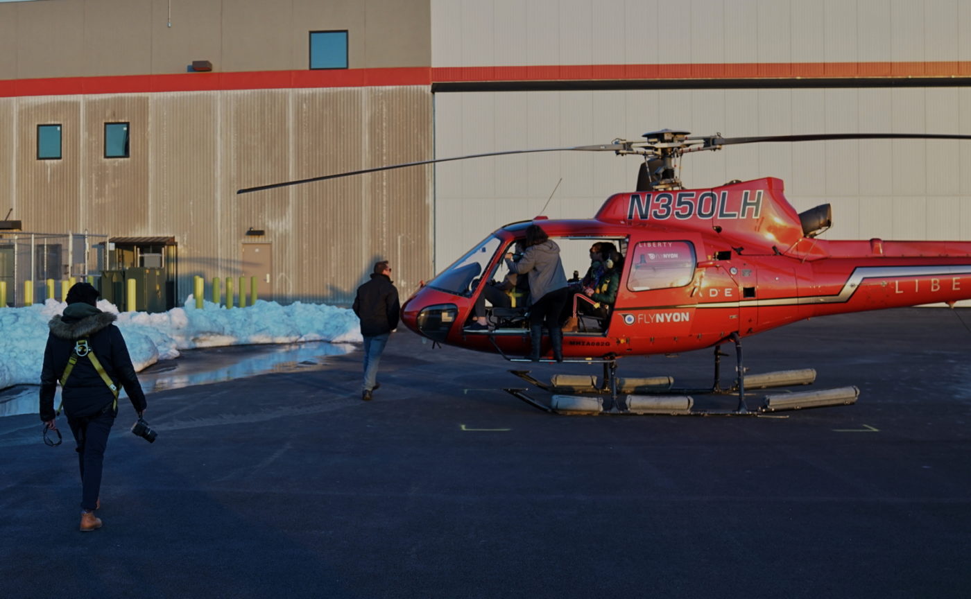 FlyNYON passenger are shown in the process of boarding a Liberty Helicopters AS350 B2 on March 11. Eric Adams Photo