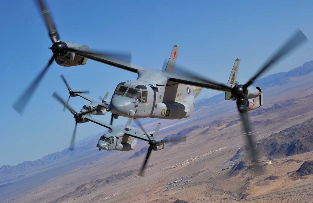 Three MV-22Bs with VMM-164 Knightriders fly formation in the desert in California. Now a decade into its service with the U.S. Marine Corps, the MV-22B has proven the value of the tiltrotor concept. Skip Robinson Photo