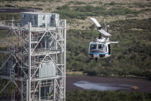 During an early morning training exercise for aircraft operations pilots at the Kennedy Space Center, a NASA UH-1 “Huey” helicopter flies past the Mobile Launcher that will be used for the agency’s new Space Launch System rocket. The new launch vehicle will send humans to deep-space destinations such as a near-Earth asteroid or Mars. The center’s helicopter operations support numerous missions at the multi-user spaceport. NASA/Kim Shiflett Photo