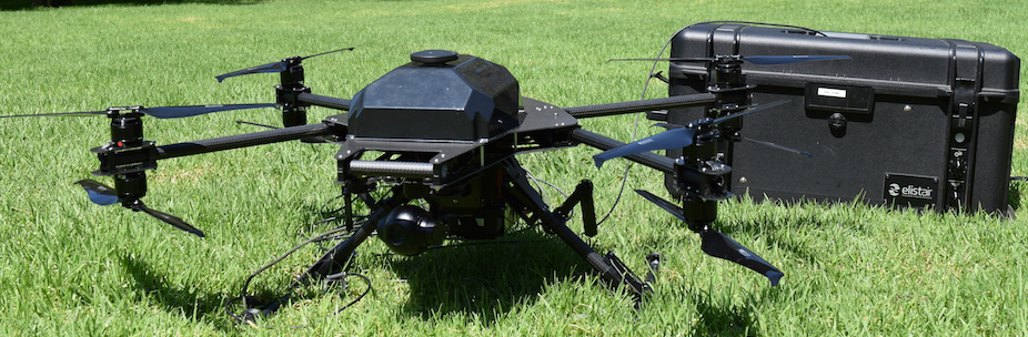 Drone sits on grass.