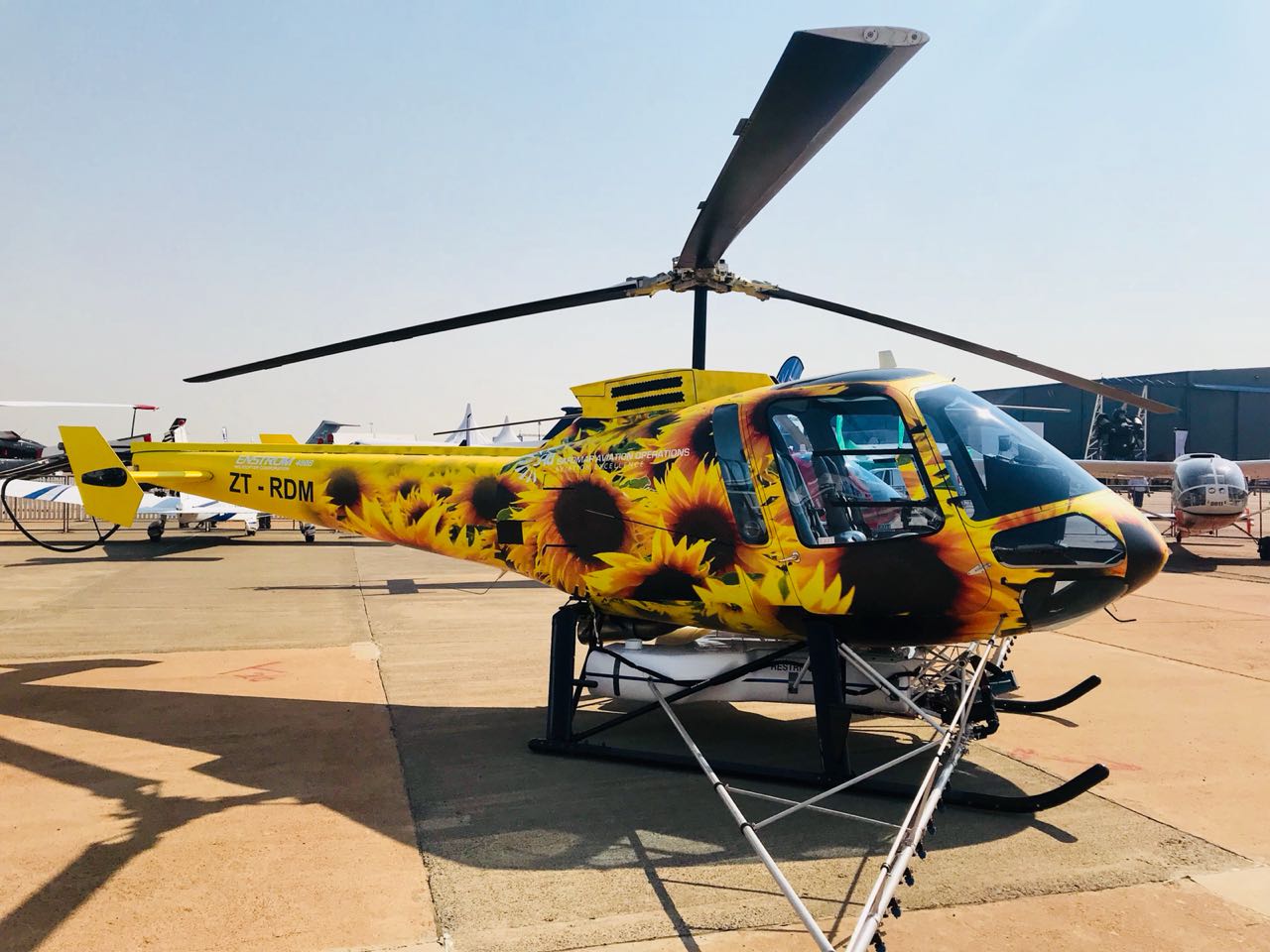 Shown is a 480B turbine helicopter in crop spraying configuration, which is on display at the AAD expo. Enstrom Photo