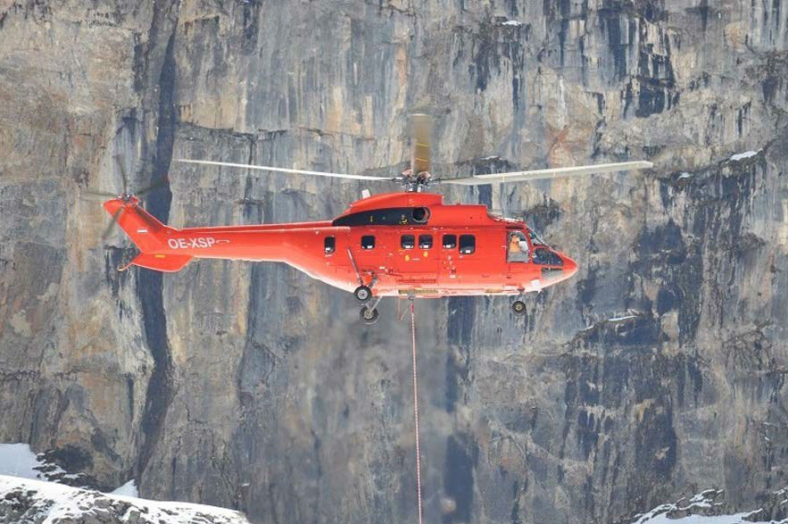 Airbus Helicopters' AS332 Super Puma aircraft performing external loadwork using a longline. Onboard Systems Photo
