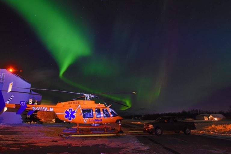 A LifeMed Alaska Bell 407 under beautiful northern lights. Photo submitted by Steven Heyano