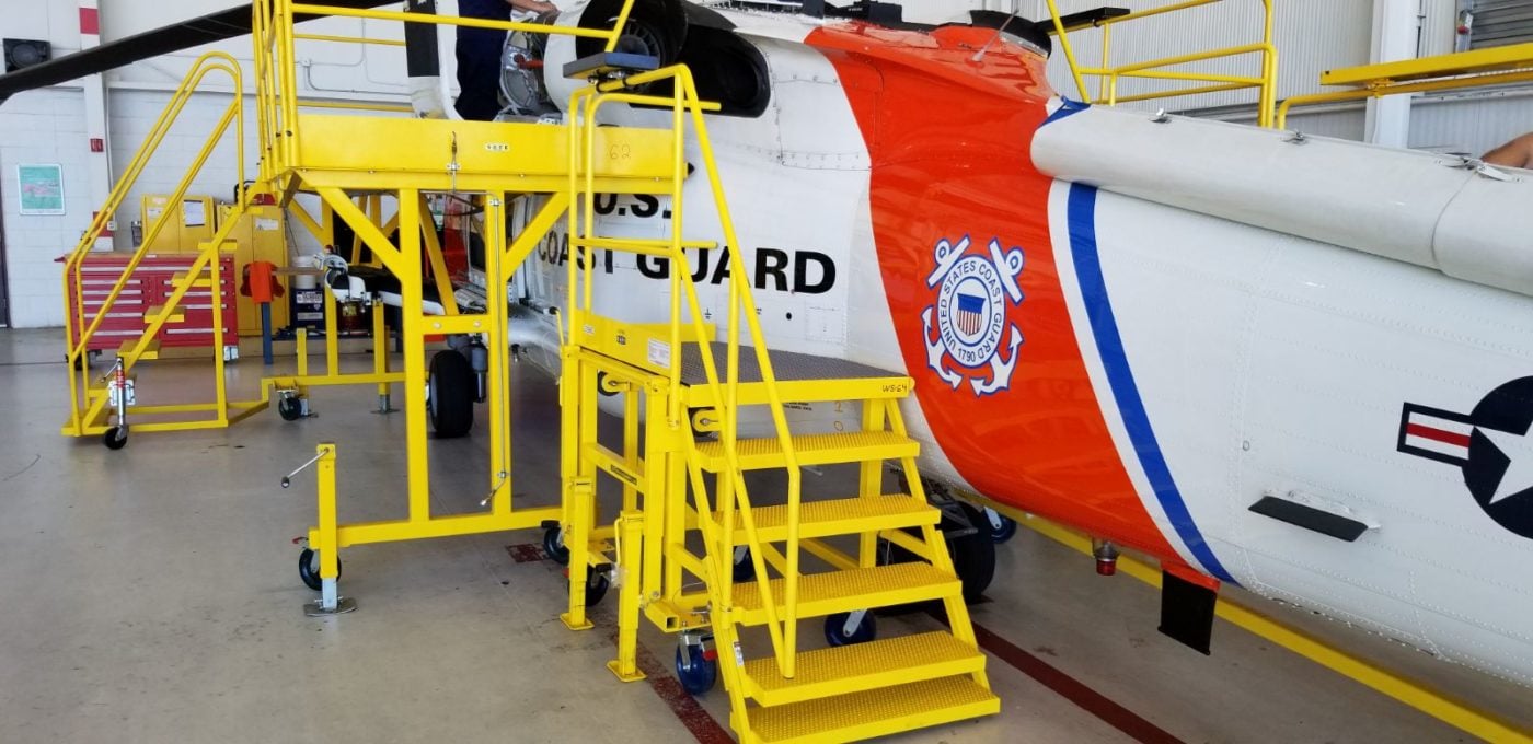 The check stand was designed for ergonomic access the fire suppression bottle for the MH-60 Jayhawk during inspection, routine maintenance or complete overhaul. S.A.F.E. Photo