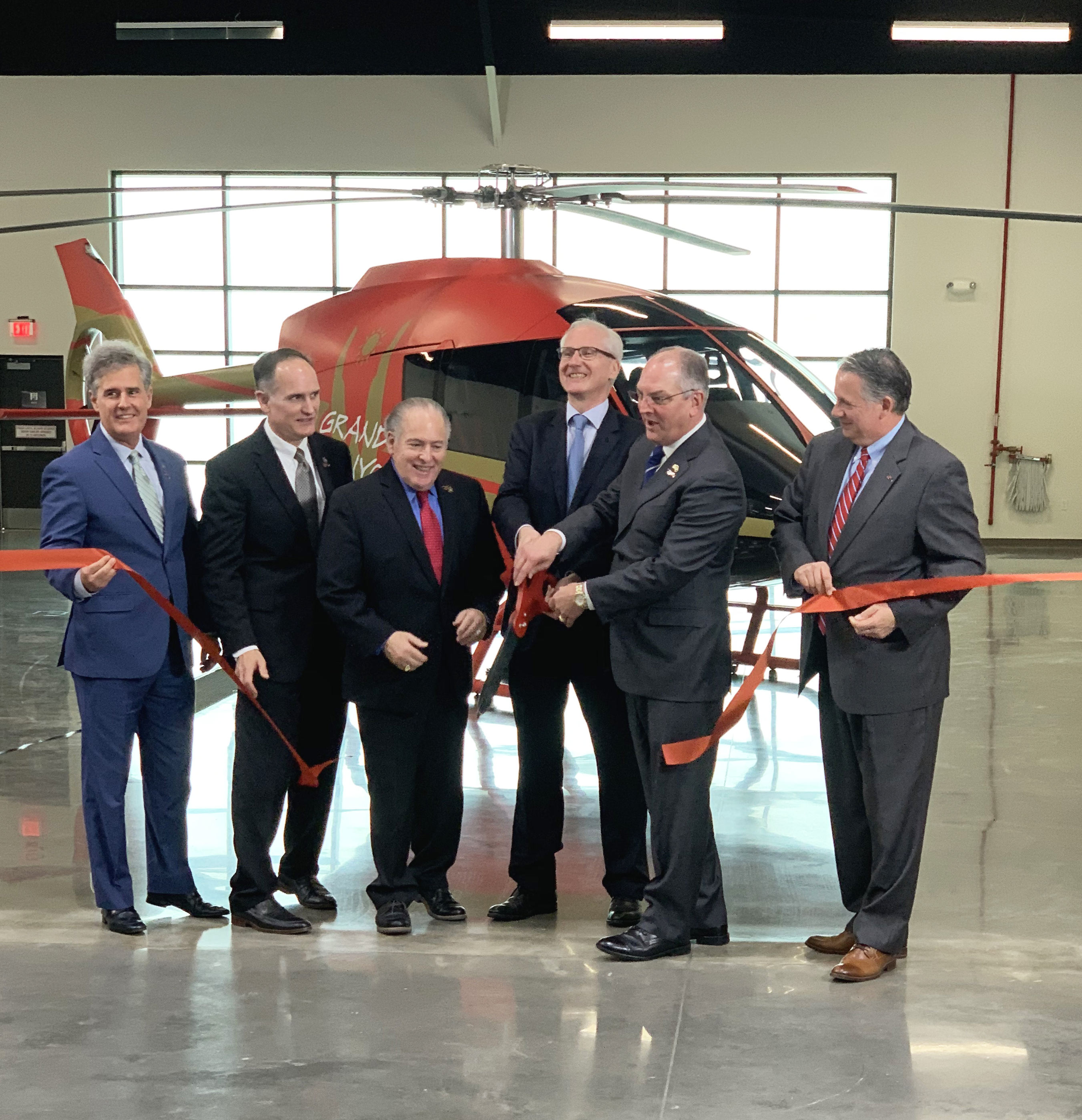 Louisiana Gov. John Bel Edwards and Kopter CEO Andreas Löwenstein cut the ribbon in the manufacturer's new facility in Lafayette, Louisiana. Kopter Photo