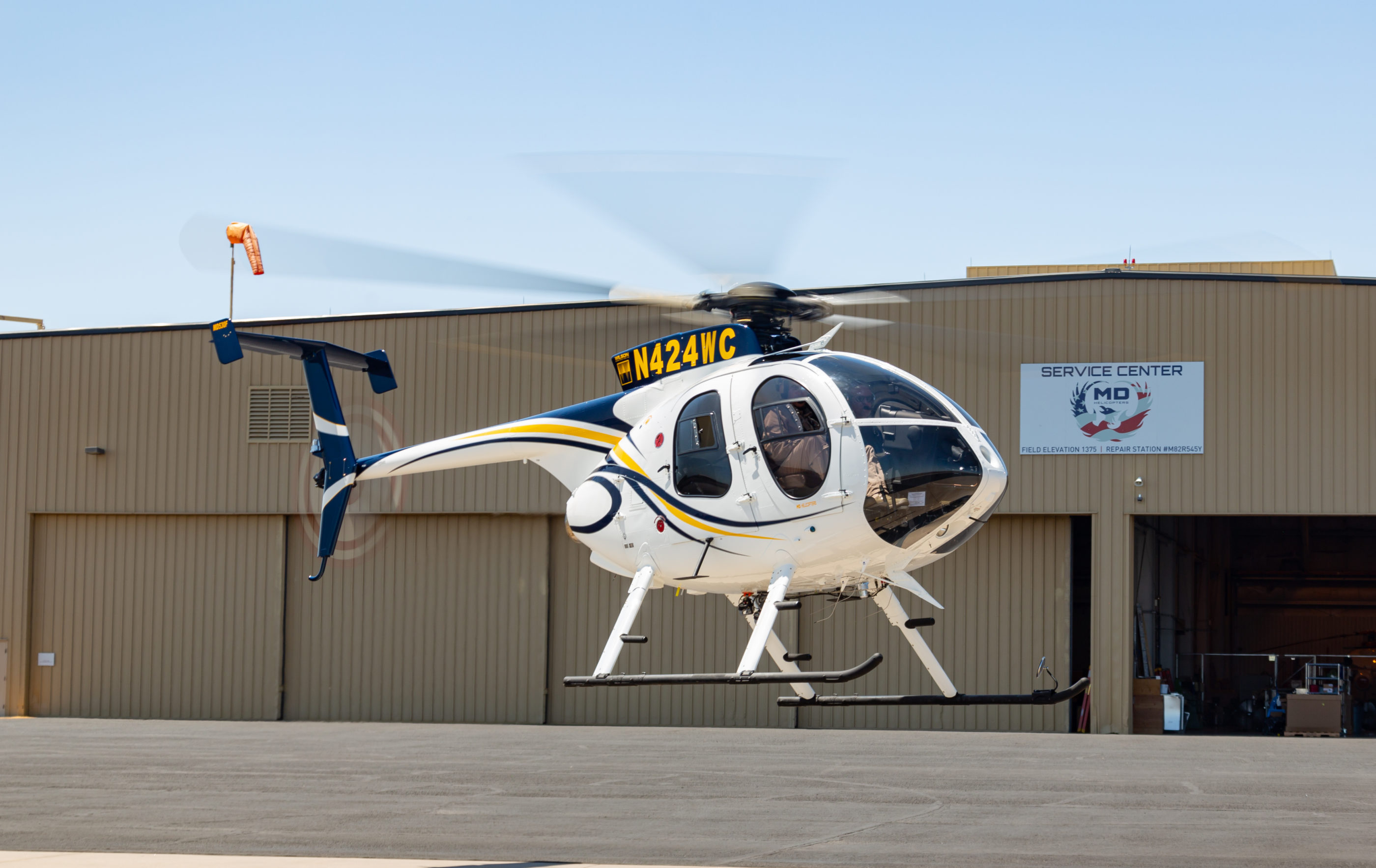 Wilson Construction takes delivery of its newly certified MD 530F conversion completed by MD Helicopters. MDHI Photo