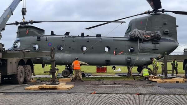 The RAF Benson-based Chinook is lifted from the mire by two cranes and placed on a prepared platform on Jan. 11. RAF Benson Photo