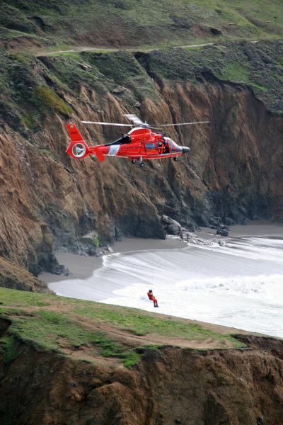 An Airbus HH-65C Dolphin from US Coast Guard Air Station San Francisco practices cliff operations off Mori Point. Matt Udkow Photo