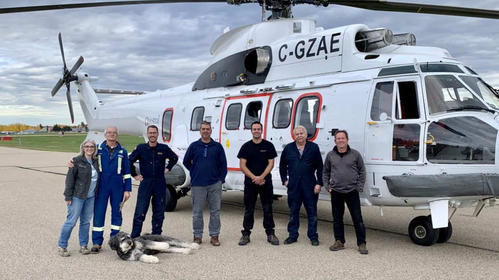 The Questral team poses alongside the Airbus AS332 L2 Super Puma after their first flight with the aircraft. Questral Helicopters Photo