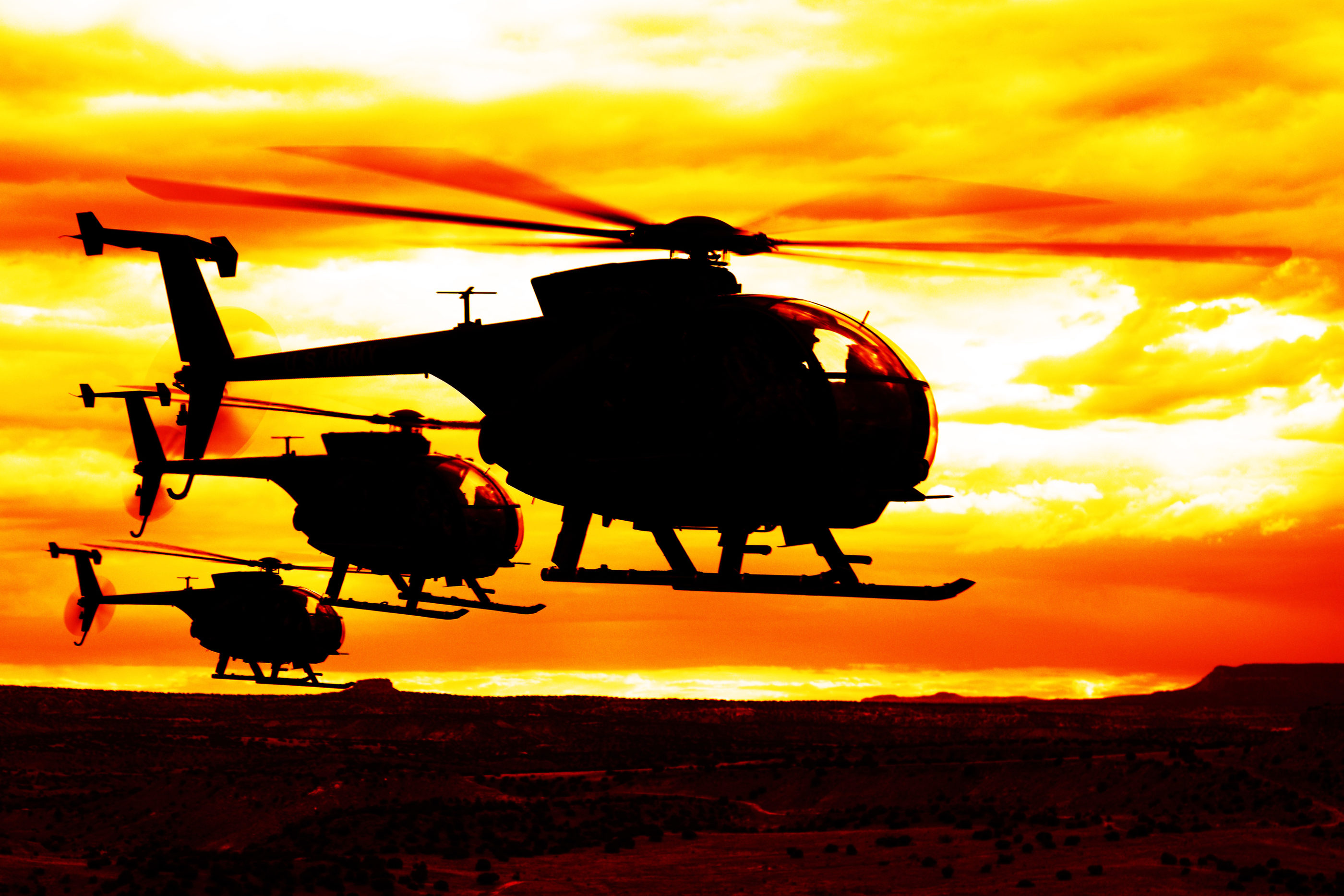 A trio of MD MH-6M Little Birds from the U.S. Special Operations Training Battalion work in the desert. Ted Carlson Photo