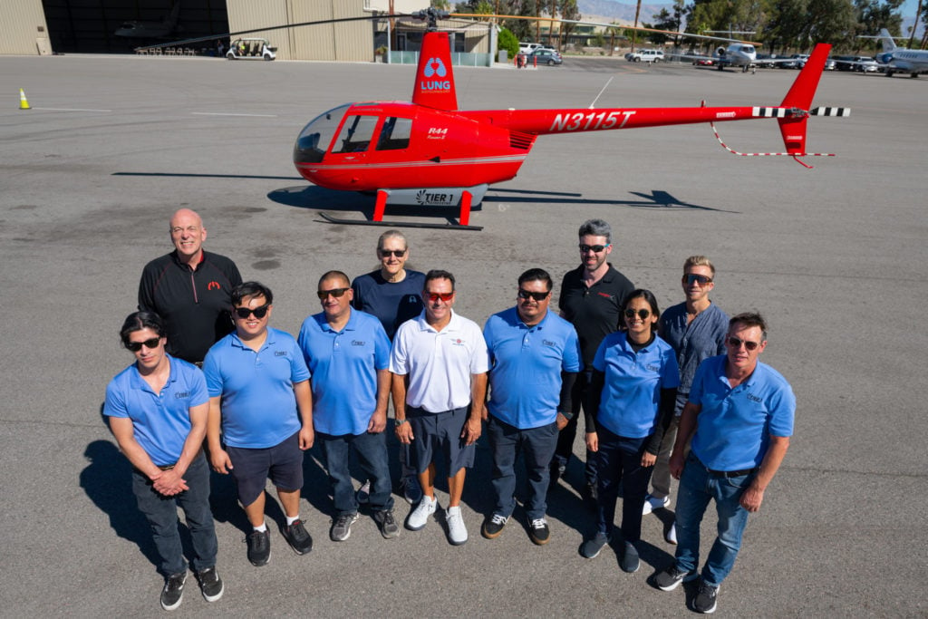 The team behind the e-R44's landmark flight stands alongside the aircraft. Dan Megna Photo